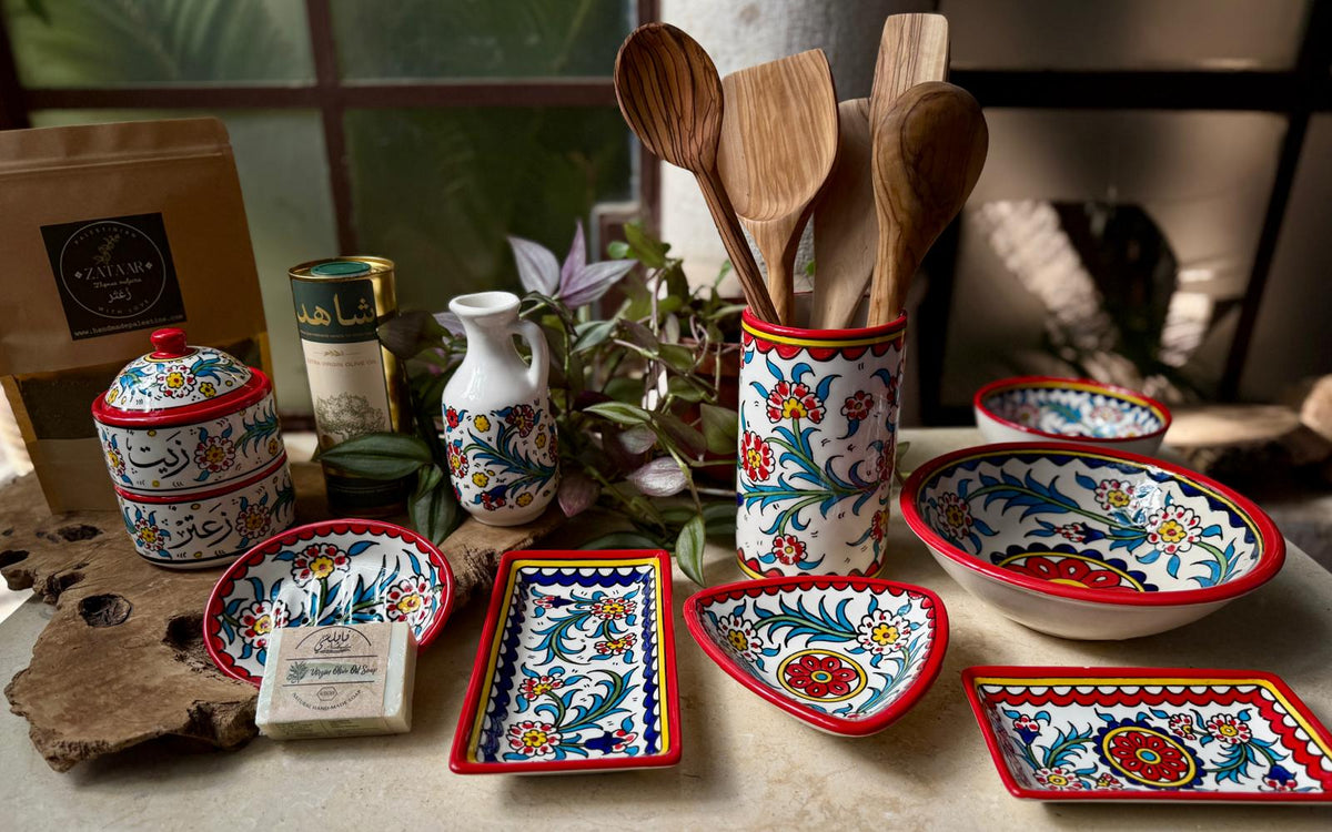 Spread of beautiful red and gold hand-painted ceramic pots and plates