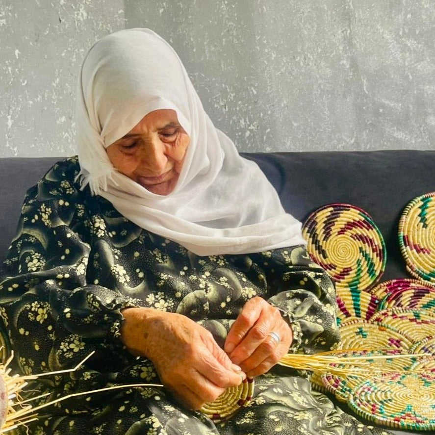 Palestinian Woman making a basket