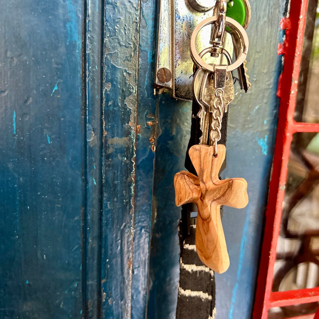 Hand-carved olive wood dolphin key on sale chain