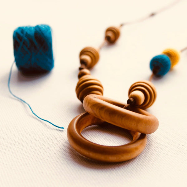 Little Olea - Wooden Nursing Necklace With Blue & Yellow Crocheted Beads