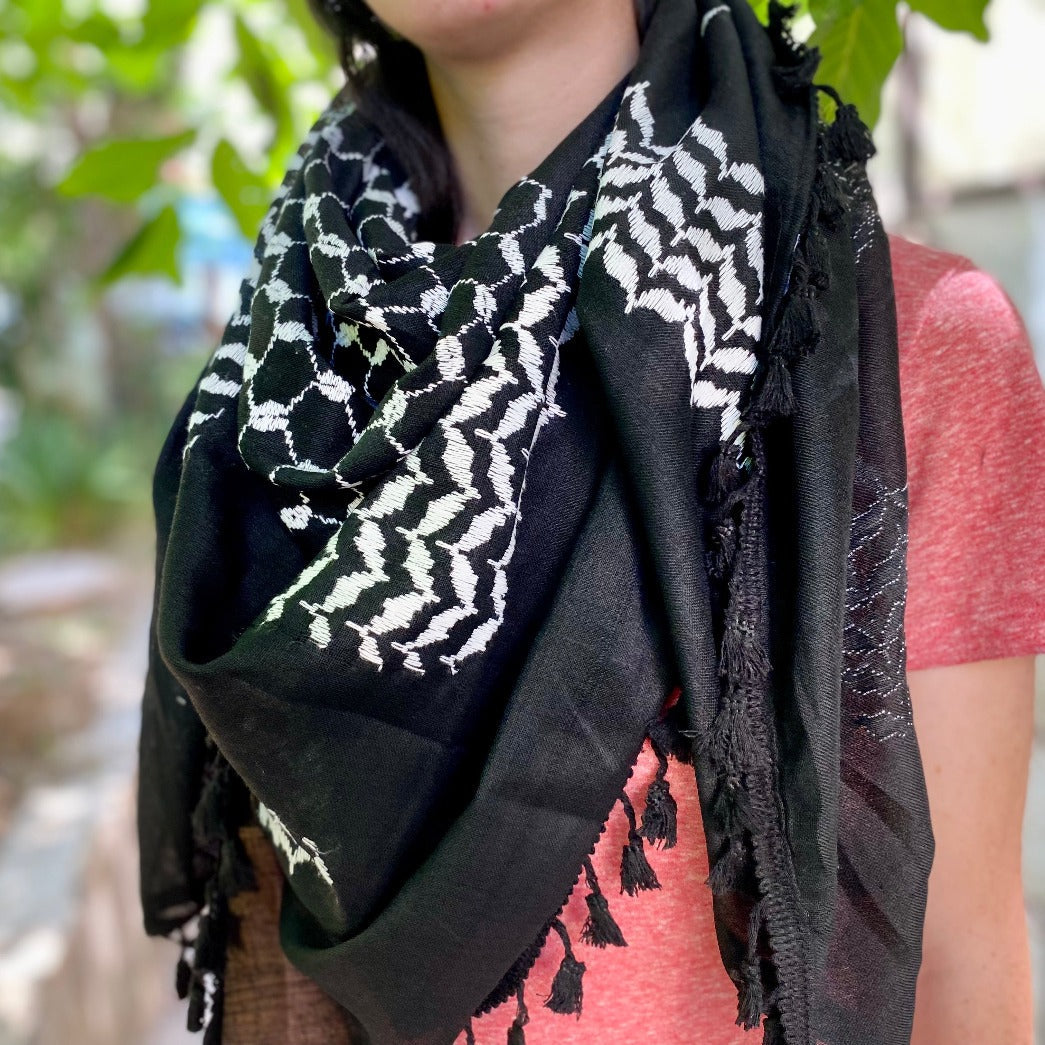 Young man with Palestinian keffiyeh feeling inner world, Stock